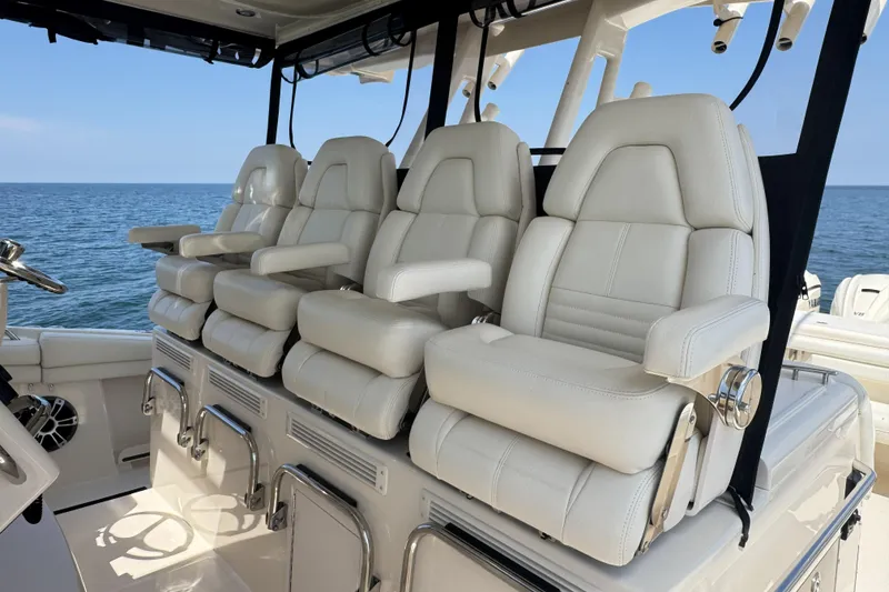 Slide: The Image of Luxurious seating on 2019 Grady-White Canyon 456 boat, ocean backdrop. - 25