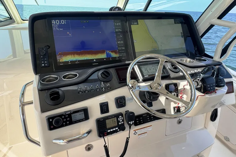 Slide: The Image of Helm of 2019 Grady-White Canyon 456 with advanced navigation and control systems. - 26