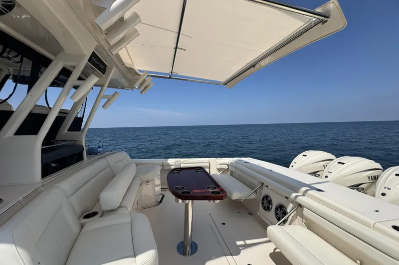 Slide: The Image of 2019 Grady-White Canyon 456 boat interior with ocean view and Yamaha engines. - 21
