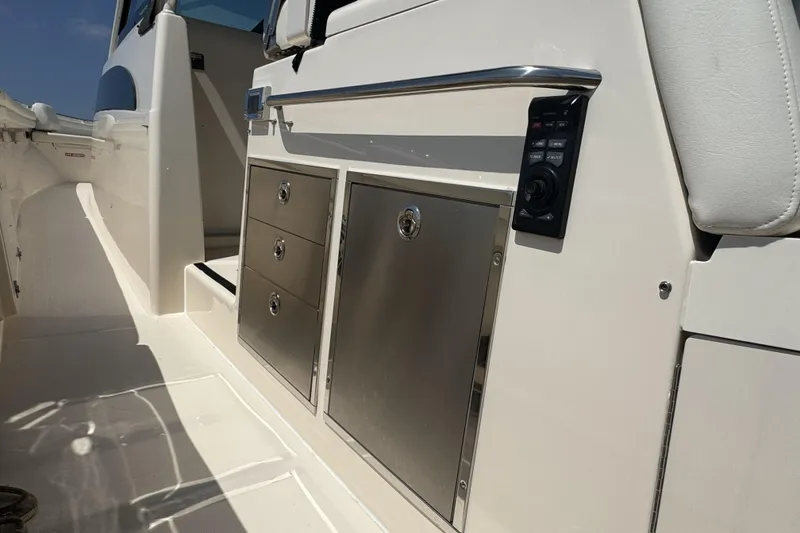 Slide: The Image of 2019 Grady-White Canyon 456 boat interior with stainless steel storage compartments. - 19