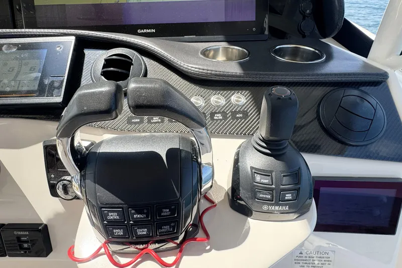 Slide: The Image of 2019 Grady-White Canyon 456 helm with Yamaha controls and Garmin display. - 28