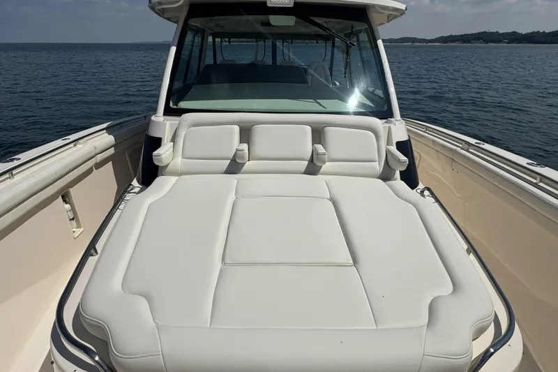 Slide: The Image of 2019 Grady-White Canyon 456 boat with spacious deck seating on open water. - 33