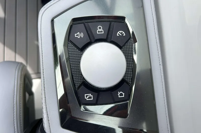 Slide: The Image of Control panel of 2021 Nautique Super Air Nautique GS24 boat with various function buttons. - 24