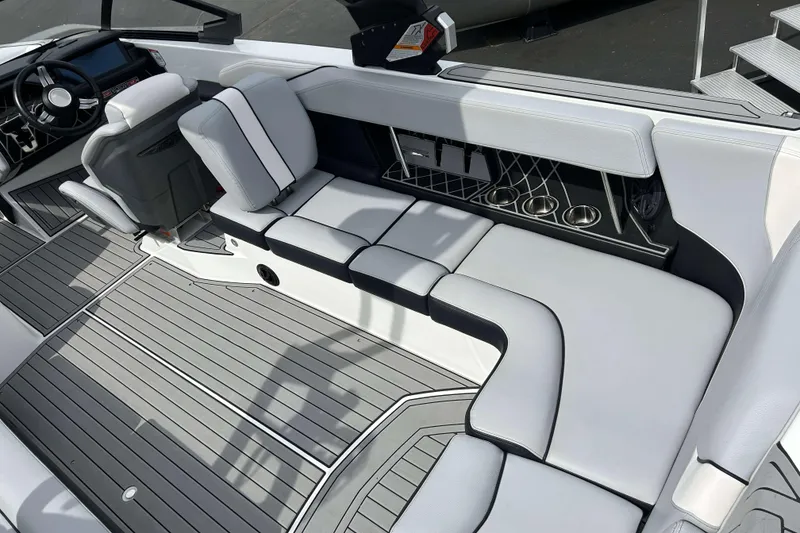 Slide: The Image of 2021 Nautique Super Air Nautique GS24 interior with sleek seating and modern design. - 10