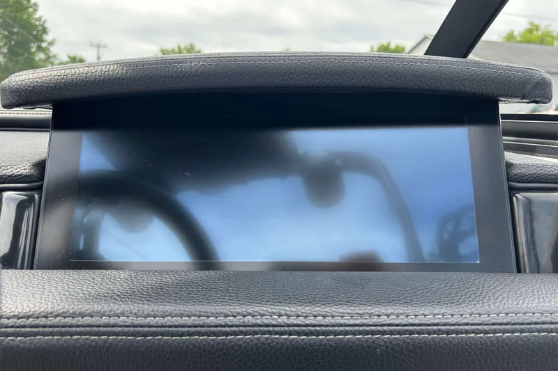 Slide: The Image of 2021 Nautique Super Air Nautique GS24 dashboard screen with leather trim. - 22