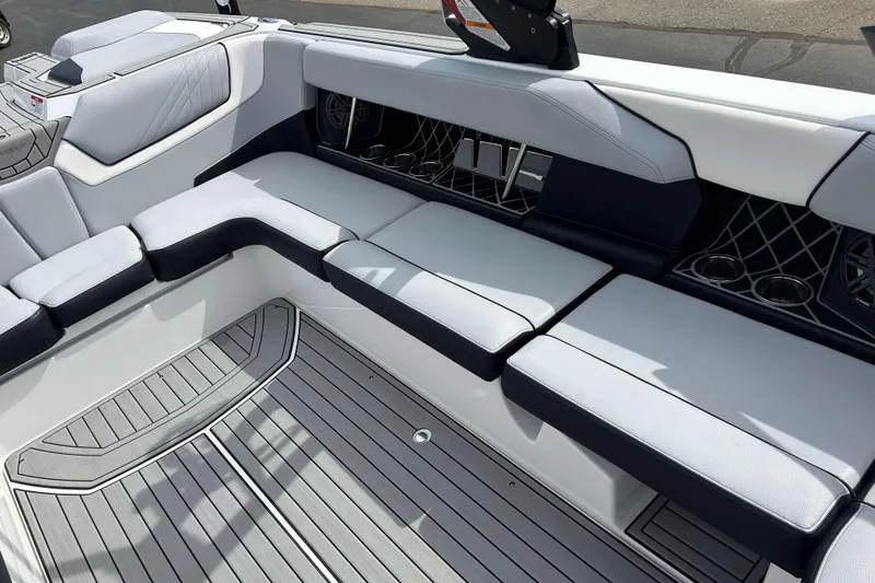 Slide: The Image of 2021 Nautique Super Air Nautique GS24 interior with sleek seating and modern design. - 13
