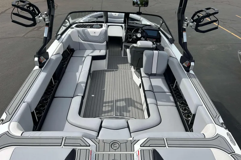 Slide: The Image of 2021 Nautique Super Air Nautique GS24 interior with spacious seating and modern design. - 8