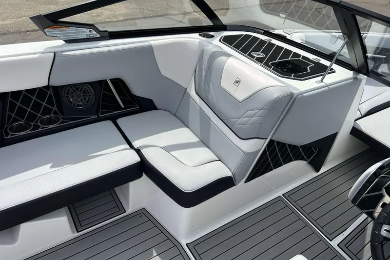 Slide: The Image of 2021 Nautique Super Air Nautique GS24 interior with sleek seating and modern design. - 15