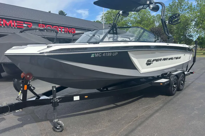 Slide: The Image of 2021 Nautique Super Air Nautique GS24 boat on trailer, parked outside dealership. - 30