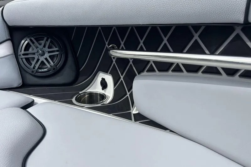 Slide: The Image of Interior of 2021 Nautique Super Air Nautique GS24 with speaker, cup holder, and sleek design. - 29