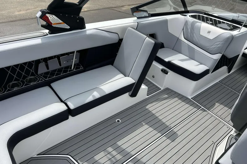 Slide: The Image of 2021 Nautique Super Air Nautique GS24 interior with sleek seating and modern design. - 14