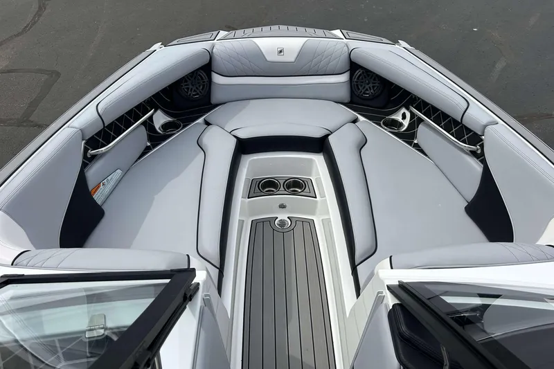 Slide: The Image of 2021 Nautique Super Air Nautique GS24 boat interior with luxurious seating and sleek design. - 26