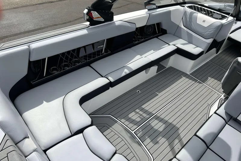 Slide: The Image of 2021 Nautique Super Air Nautique GS24 interior with sleek seating and modern design. - 9