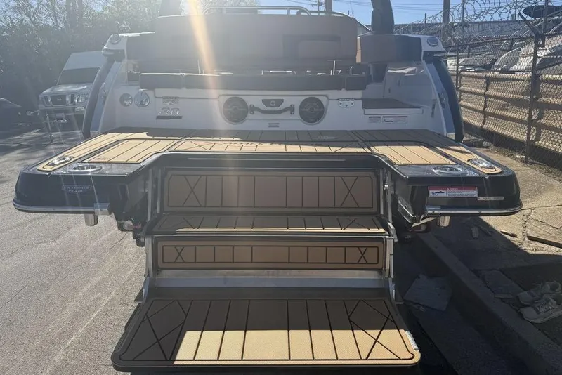 Slide: The Image of 2026 Chaparral SSX 30 boat with extended swim platform and sunlit deck. - 8
