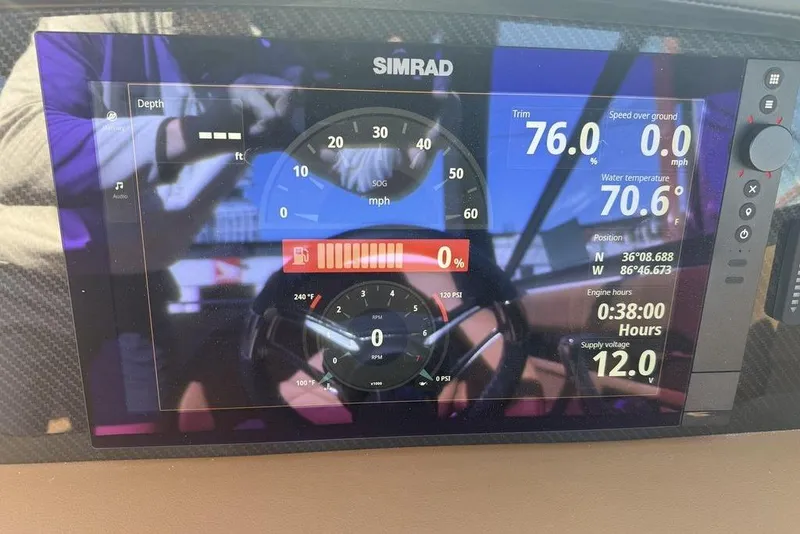 Slide: The Image of Simrad display on 2026 Chaparral SSX 30 showing navigation and engine data. - 9