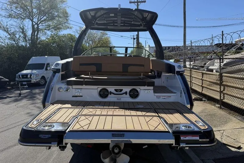 Slide: The Image of 2026 Chaparral SSX 30 boat with spacious deck and seating, parked outdoors. - 6
