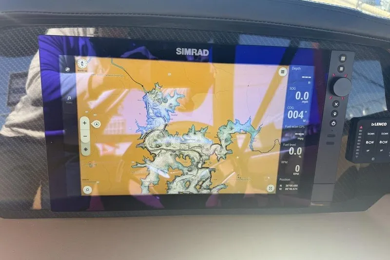 Slide: The Image of Simrad navigation display on 2026 Chaparral SSX 30 boat, showing detailed map and data. - 10