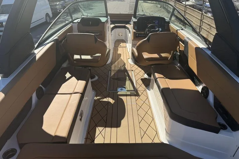 Slide: The Image of 2026 Chaparral SSX 30 boat interior with luxurious seating and modern dashboard. - 13