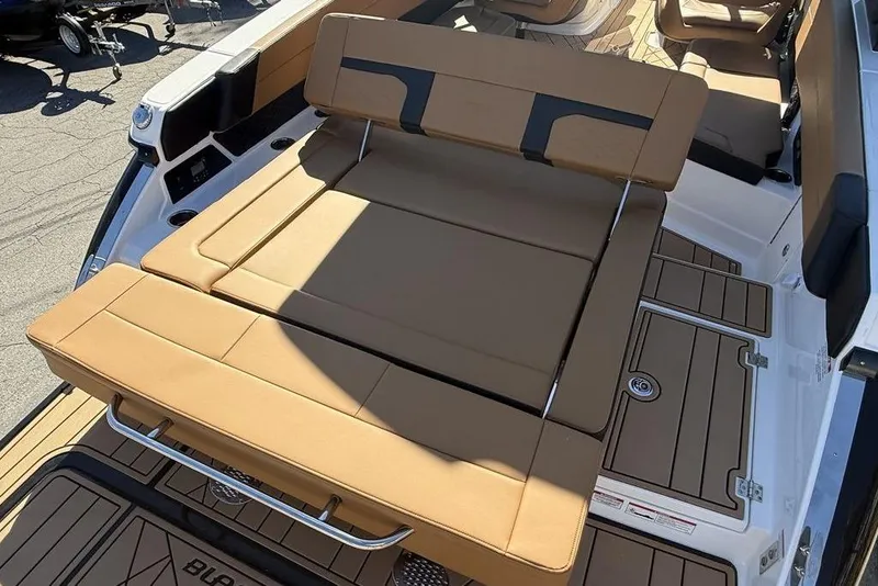 Slide: The Image of 2026 Chaparral SSX 30 boat with tan seating and sleek deck design. - 11