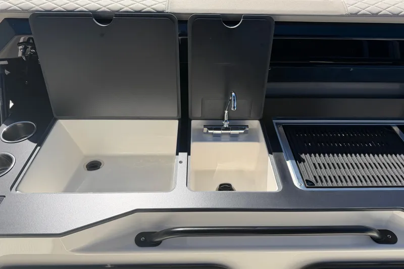 Slide: The Image of Outdoor kitchen setup on a 2026 Navan S30 boat, featuring sink and grill. - 20