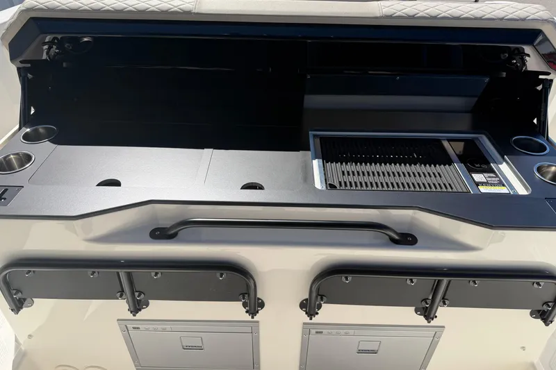Slide: The Image of 2026 Navan S30 boat interior with grill and storage compartments. - 19