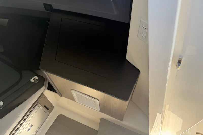 Slide: The Image of Interior of 2026 Navan S30, featuring sleek cabinetry and modern electrical outlet. - 23