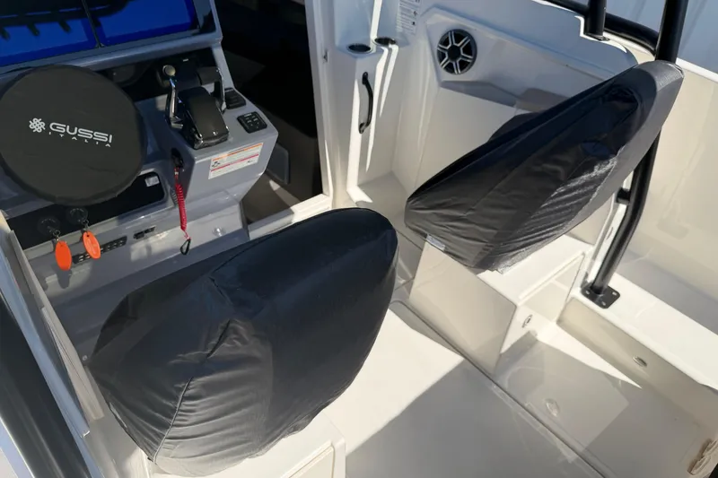 Slide: The Image of Interior of 2026 Navan S30 boat with covered seats and control panel. - 31