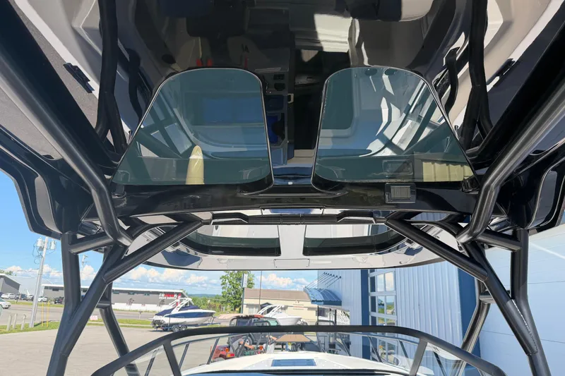 Slide: The Image of 2026 Navan S30 boat interior with sleek black framework and glass panels. - 16