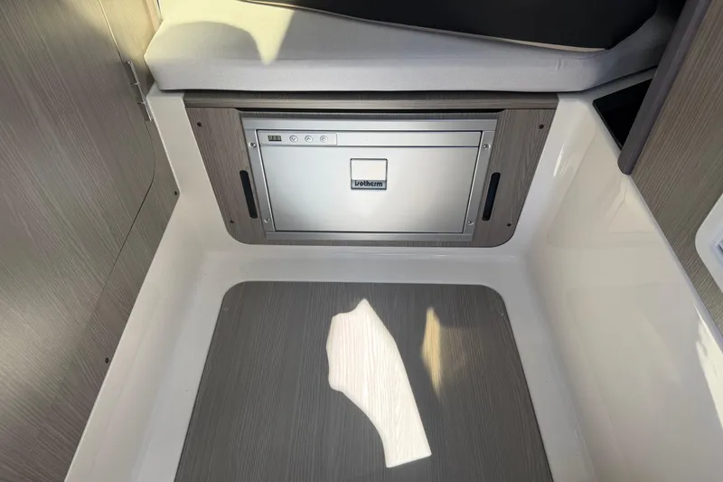 Slide: The Image of Interior of 2026 Navan S30 featuring a compact built-in refrigerator. - 24