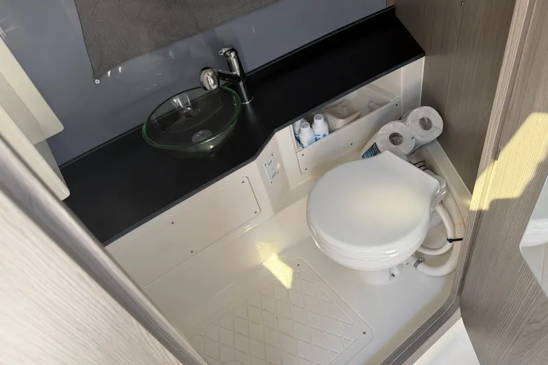 Slide: The Image of Modern bathroom in 2026 Navan S30 with glass sink and compact toilet. - 25