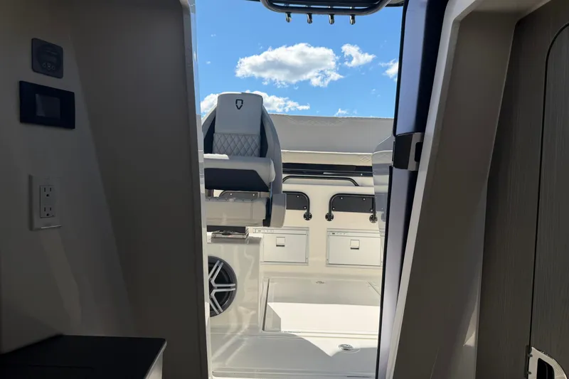 Slide: The Image of Interior view of 2026 Navan S30 boat, featuring modern seating and storage compartments. - 29