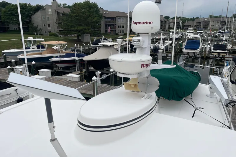 Slide: The Image of 2006 American Tug 41 with Raymarine equipment docked at a marina. - 26