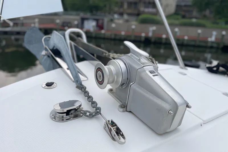 Slide: The Image of Anchor winch on 2006 American Tug 41 boat deck, featuring chain and cleat. - 27