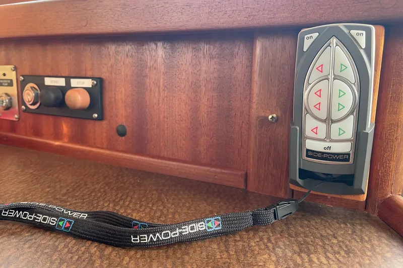 Slide: The Image of Control panel of a 2006 American Tug 41 with Side-Power thruster controls. - 16