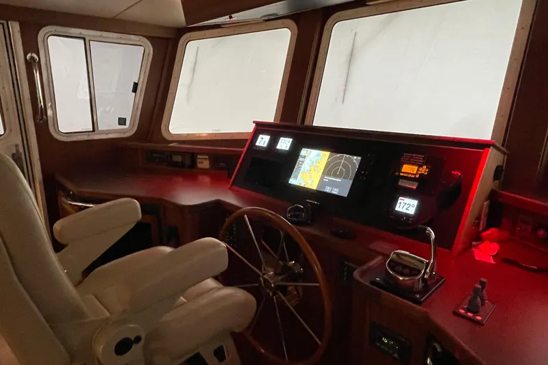 Slide: The Image of Interior helm of 2006 American Tug 41 with navigation equipment and steering wheel. - 3