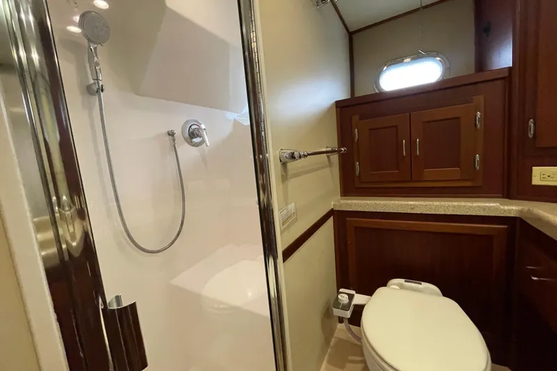 Slide: The Image of Bathroom interior of 2006 American Tug 41 with shower and wooden cabinetry. - 18