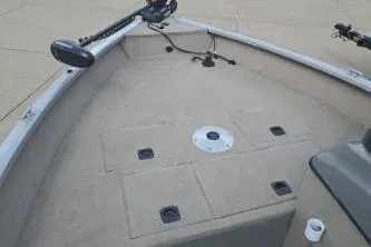 Slide: The Image of 2006 Tracker Pro Guide V-16 SC boat deck with mounted equipment and storage compartments. - 11