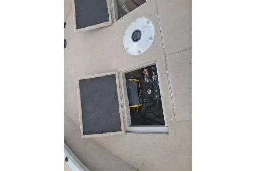 Slide: The Image of 2006 Tracker Pro Guide V-16 SC boat interior with open storage compartments. - 16