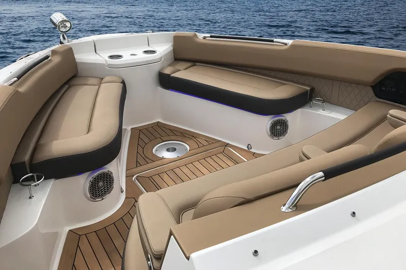 Slide: The Image of Manufacturer Provided Image: 2018 Sea Ray SLX 400 boat interior with tan seating and teak flooring. - 9