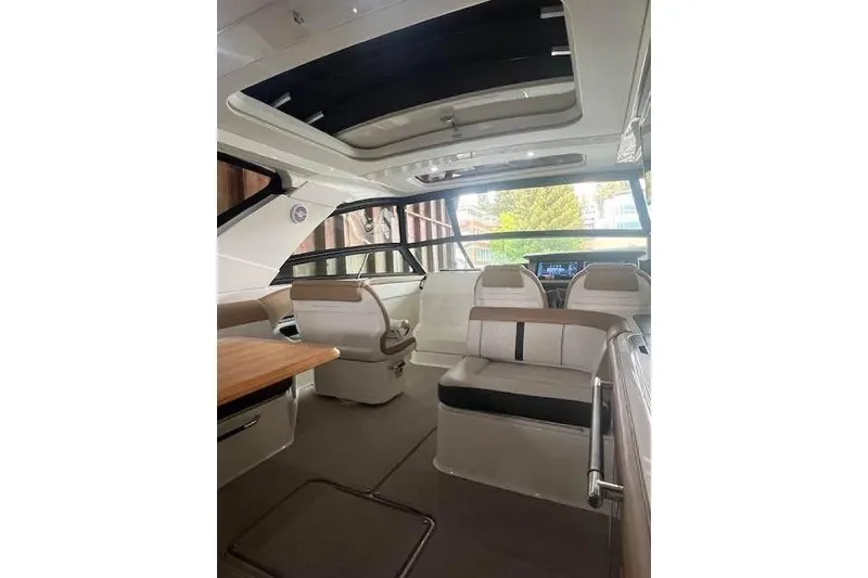 Slide: The Image of Interior of 2018 Sea Ray SLX 400 boat with modern seating and sleek design. - 2