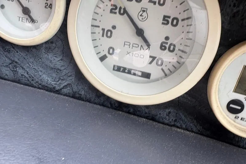 Slide: The Image of Dashboard gauges of a 1999 MasterCraft MariStar 230 Sport boat. - 7