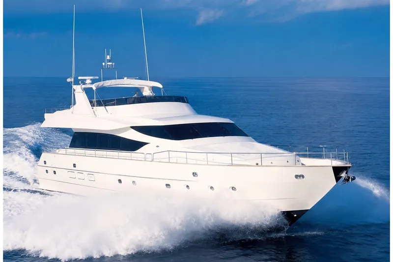 The Image of 1996 Novamarine Motor Yacht cruising on open sea under clear blue sky. - 1