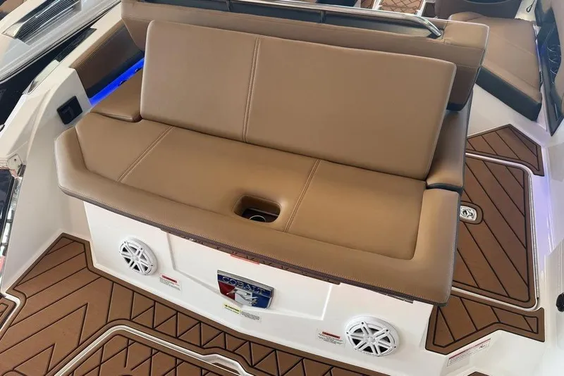 Slide: The Image of Luxury seating on 2026 Cobalt R4 boat with brown upholstery and integrated speakers. - 11