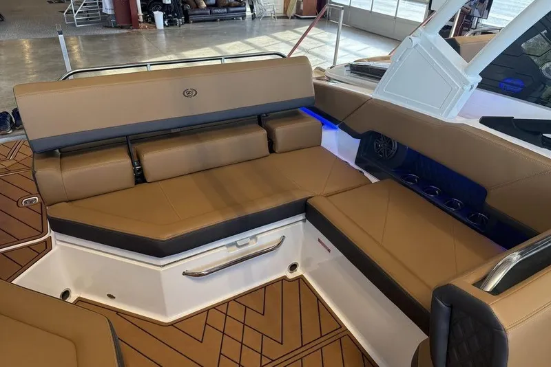 Slide: The Image of Luxurious interior of 2026 Cobalt R4 boat with tan leather seating and modern design. - 7