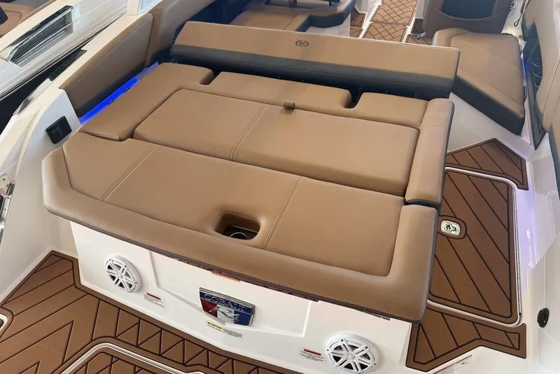 Slide: The Image of Luxurious interior of 2026 Cobalt R4 boat with tan seating and wood accents. - 13