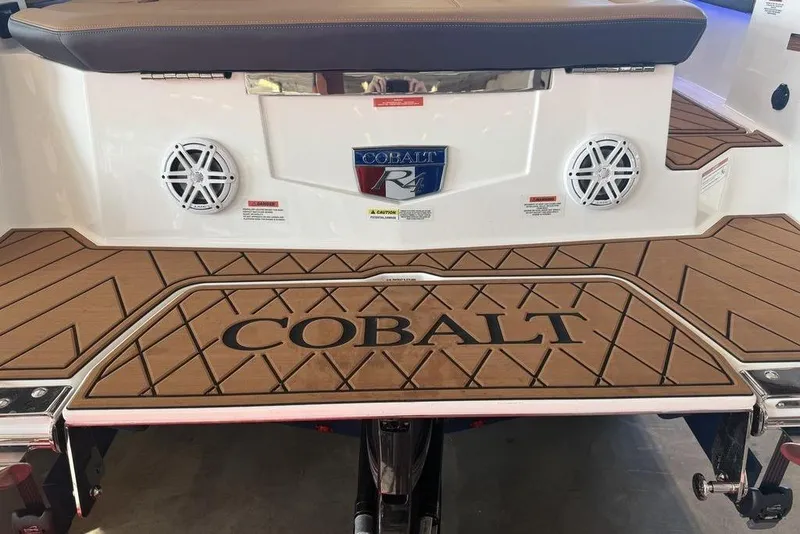 Slide: The Image of 2026 Cobalt R4 boat with teak deck and branded logo on swim platform. - 6