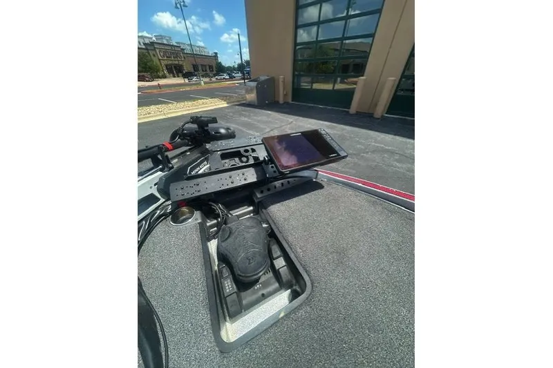 Slide: The Image of 2022 Triton 19 TrX Patriot boat dashboard with mounted electronics and controls. - 12