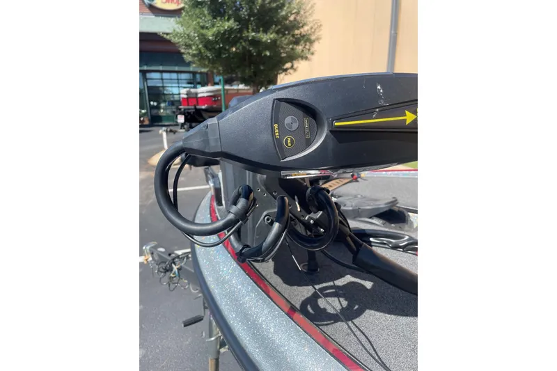 Slide: The Image of 2022 Triton 19 TrX Patriot boat with trolling motor detail in outdoor setting. - 14