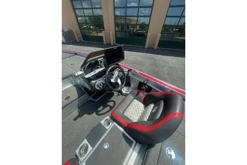 Slide: The Image of 2022 Triton 19 TrX Patriot boat interior with modern dashboard and seating. - 7