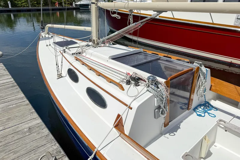 Slide: The Image of Alerion Express 28 sailboat, 1997 model, docked at marina with visible rigging and deck details. - 2